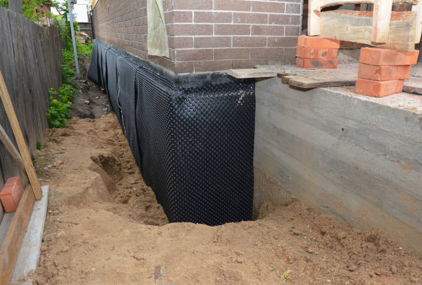 Happy homeowners after waterproofing job in Wisconsin Dells